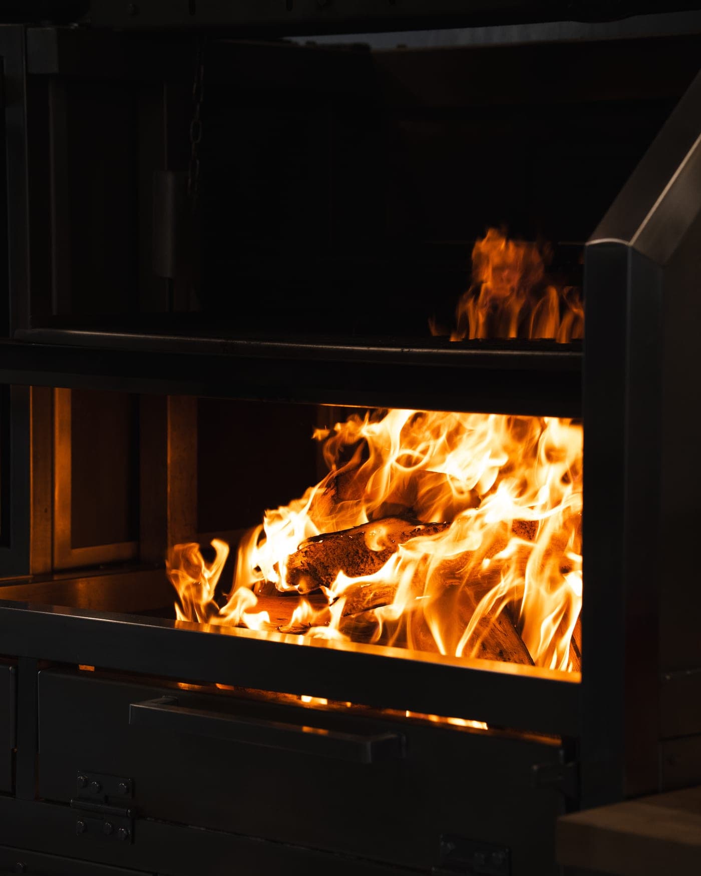 Wood burning in the grill's firebox