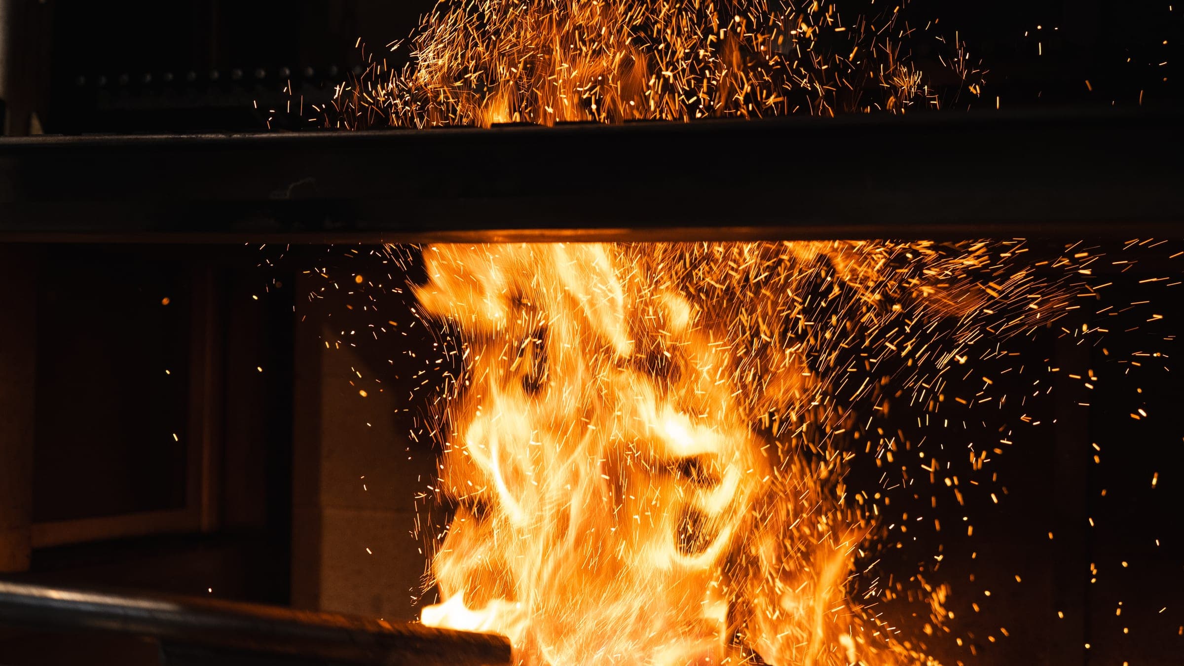 Sparks rising from the wood fire