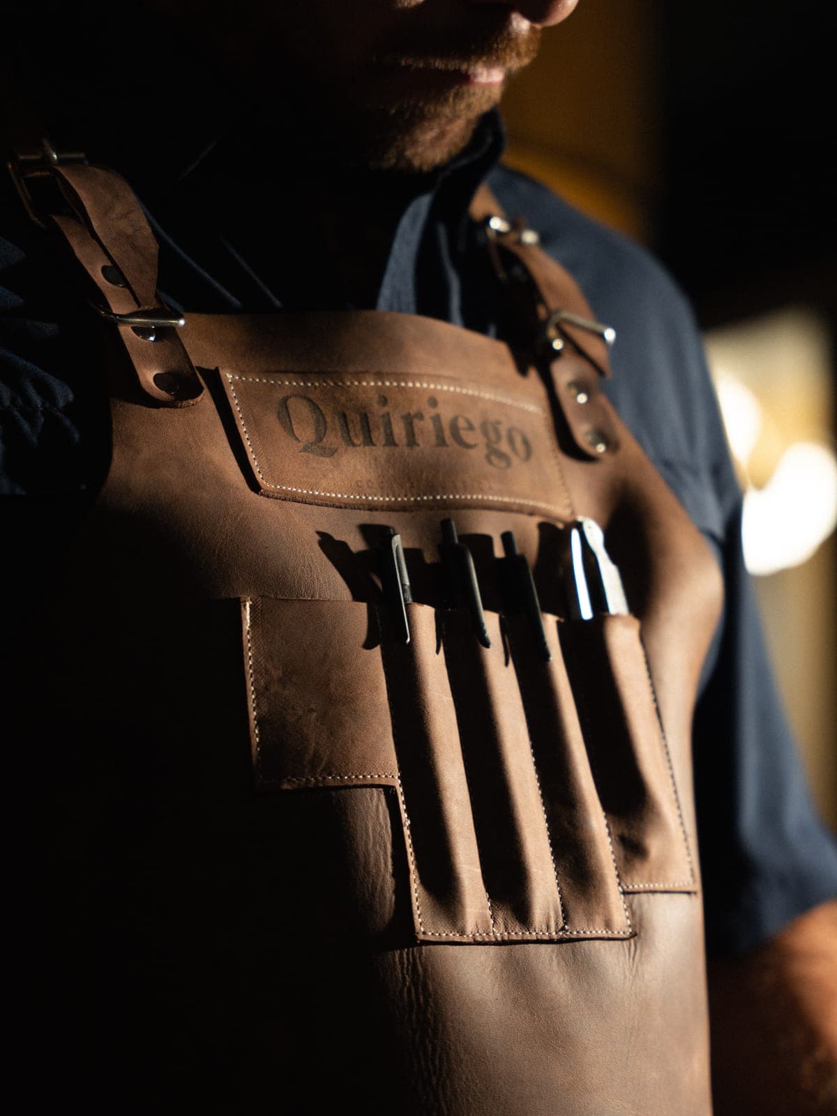 A cook's leather apron with knives