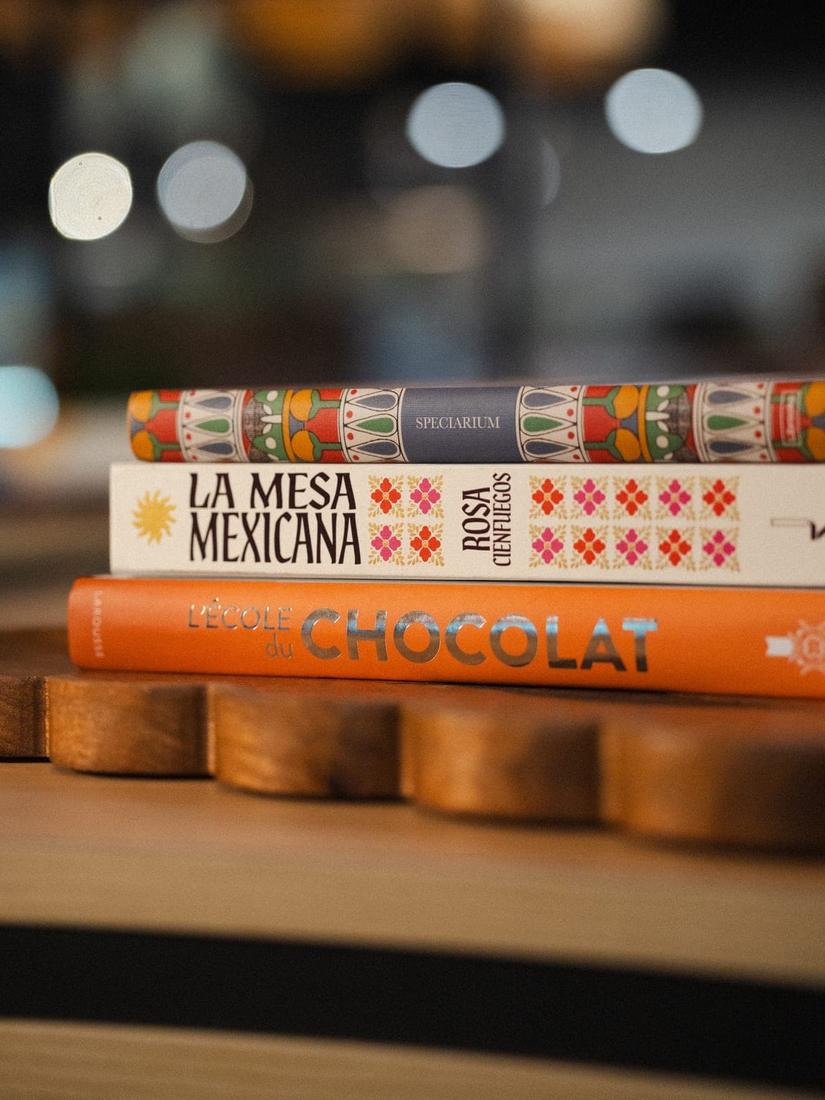 Cookbooks stacked on a shelf